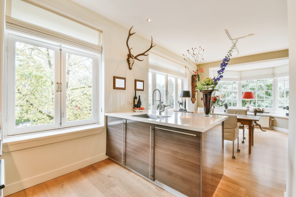 Delightful kitchen area with hardwood floor and brown kitchen unit