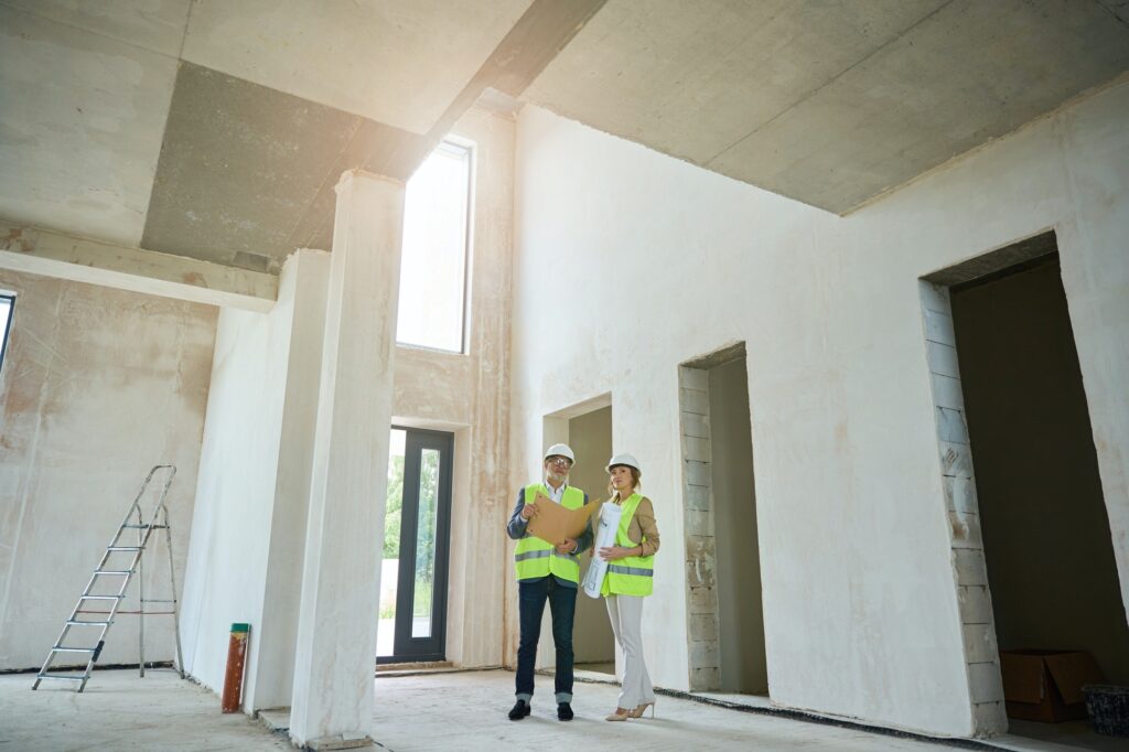 Male foreman with real estate agent discussing a project