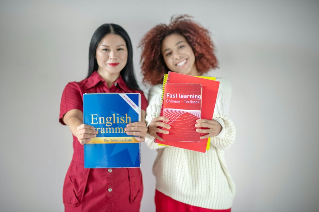 International female friends studying English language together