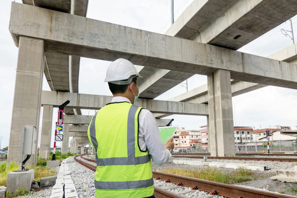 inspection engineer is checking on infrastructure and construction site.