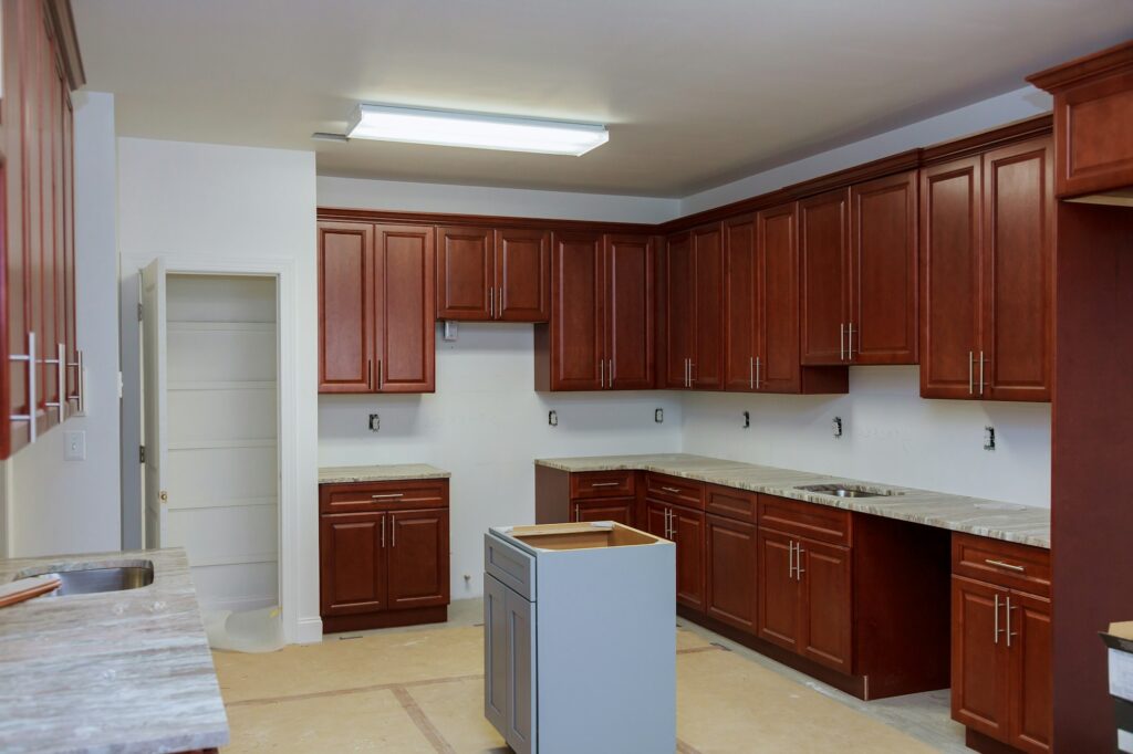 Wooden cabinets installation of in the modular kitchen of installation base cabinets